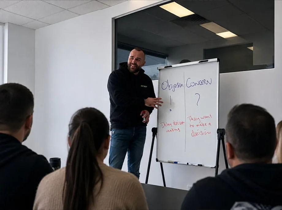 Reece Turner teaching a sales training session
